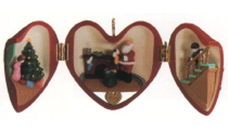 Aunt Krismas 'Santa Filling the Stockings' ornament by Ed Seale. Year: 1990 - Heart of Christmas series #1. 'Damaged Box' condition.