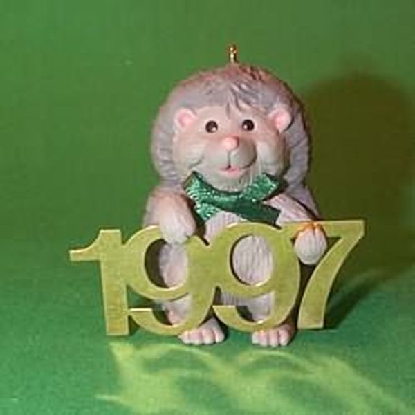 Aunt Krismas 'Hedgehog with Brass 1997' ornament by Sharon Pike. Year: 1997 - Fabulous Decade series #8. 'Mint In Box' condition.