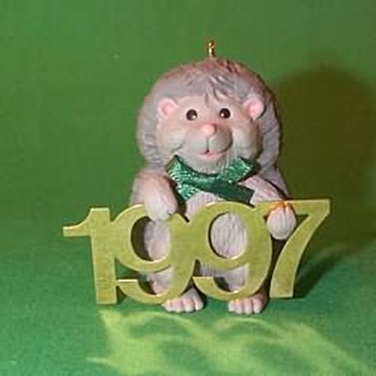 Aunt Krismas 'Hedgehog with Brass 1997' ornament by Sharon Pike. Year: 1997 - Fabulous Decade series #8. 'Mint In Box' condition.