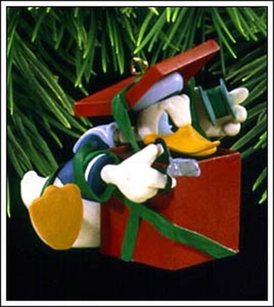 Aunt Krismas 'Donald's Surprising Gift' ornament by Katrina Bricker. Year: 1997 - Hallmark Archives series #1. 'Mint In Box' condition.