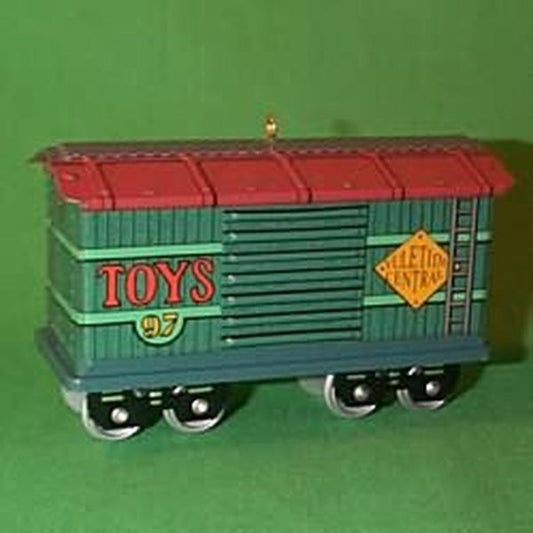 Aunt Krismas 'Cargo Car' ornament by Linda Sickman. Year: 1997 - Yuletide Central series #4. 'Mint In Box' condition.