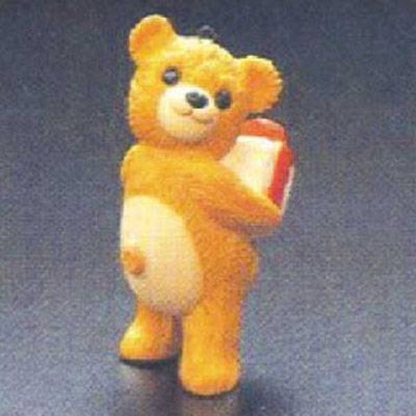 Aunt Krismas 'Cinnamon Bear with Gift' ornament by Hallmark. Year: 1986 - Porcelain Bear series #4. 'Mint In Box' condition.