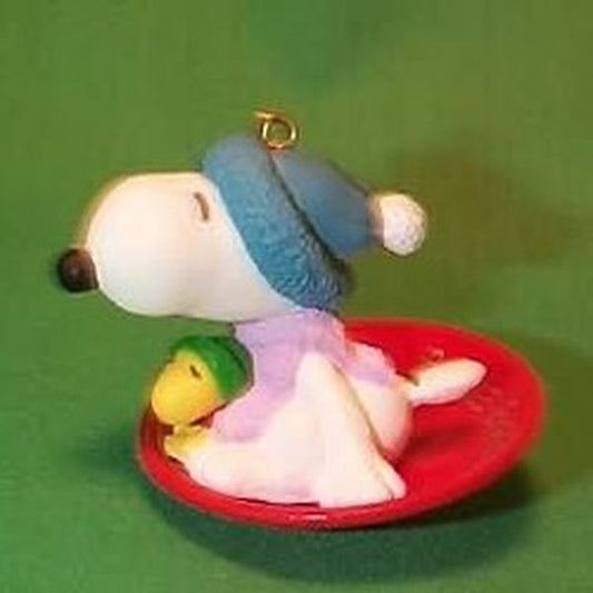 Aunt Krismas 'Snoopy and Woodstock (Sled)' ornament by Bob Siedler. Year: 1986 - Snoopy and Woodstock  series #0. 'Mint In Box' condition.