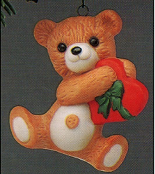Aunt Krismas 'Cinnamon Bear with Heart' ornament by Sharon Pike. Year: 1988 - Porcelain Bear series #6. 'Slightly Damaged Box' condition.