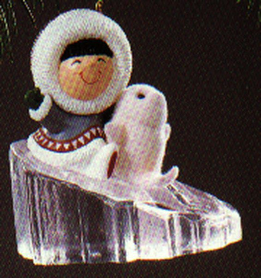 Aunt Krismas 'Sliding Down Iceberg' ornament by Ed Seale. Year: 1990 - Frosty Friends series #11. 'Mint In Box' condition.