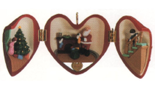 Aunt Krismas 'Santa Filling the Stockings' ornament by Ed Seale. Year: 1990 - Heart of Christmas series #1. 'Damaged Box' condition.