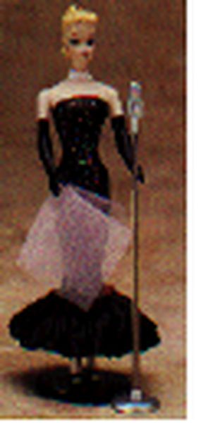 Aunt Krismas 'Solo in the Spotlight' ornament by Patricia Andrews. Year: 1995 - Barbie series #2. 'Mint In Box' condition.