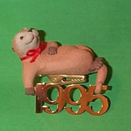 Aunt Krismas 'Otter with Brass 1995' ornament by Ed Seale. Year: 1995 - Fabulous Decade series #6. 'Mint In Box' condition.