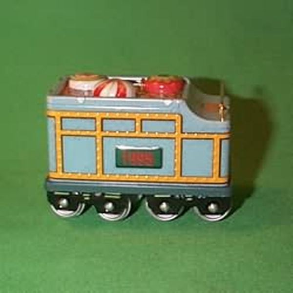 Aunt Krismas 'Coal Car' ornament by Linda Sickman. Year: 1995 - Yuletide Central series #2. 'Mint In Box' condition.
