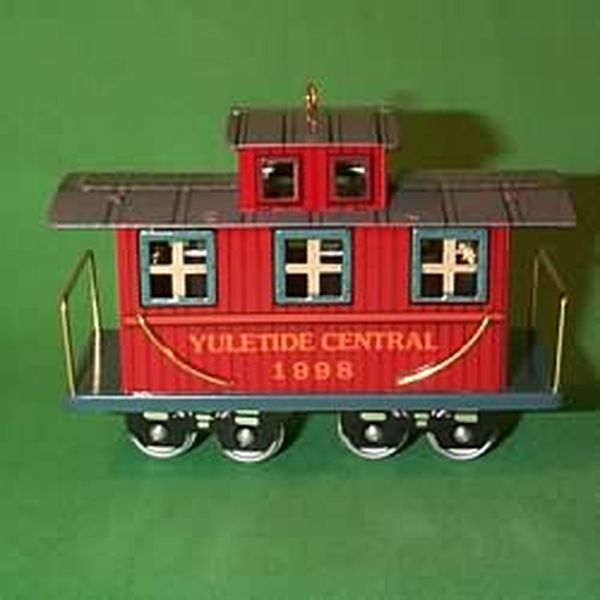 Aunt Krismas 'Caboose' ornament by Linda Sickman. Year: 1998 - Yuletide Central series #5. 'Mint In Box' condition.