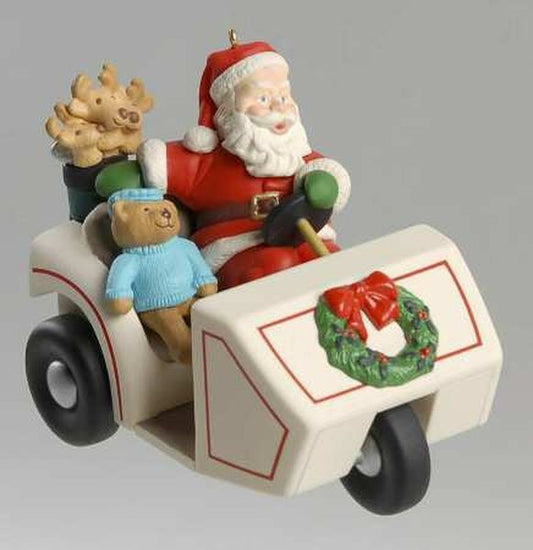 Aunt Krismas 'Santa’s Golf Cart' ornament by Dill Rhodus. Year: 1999 - Here Comes Santa series #21. 'Mint In Box' condition.