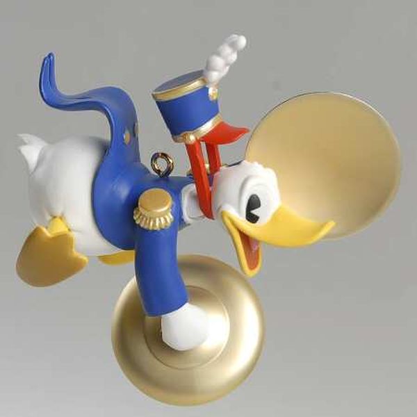 Aunt Krismas 'Donald Plays the Cymbals' ornament by Robert Chad. Year: 1999 - Mickey's Holiday Parade series #3. 'Mint In Box' condition.