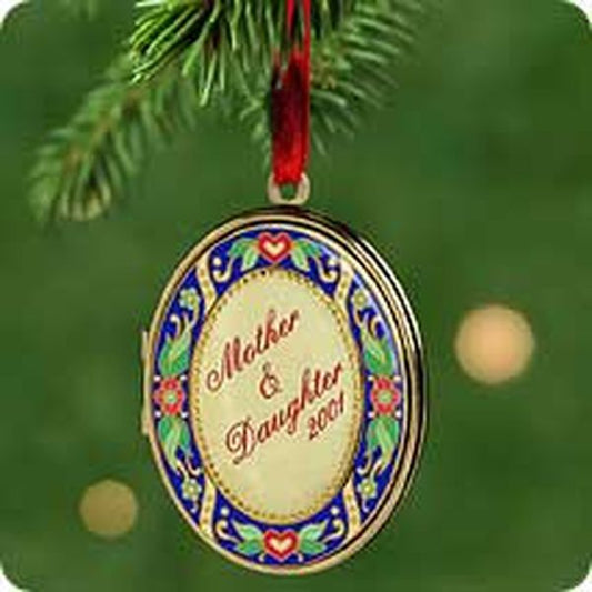 Aunt Krismas 'Mother and Daughter Locket' ornament by LaDene Votruba. Year: 2001 - N/A series #0. 'Mint In Box' condition.