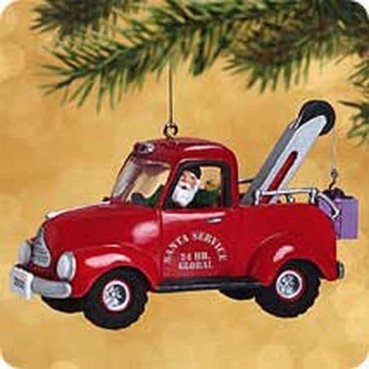 Aunt Krismas 'North Pole Towing Service' ornament by Duane Unruh. Year: 2002 - Here Comes Santa series #24. 'Mint In Box' condition.