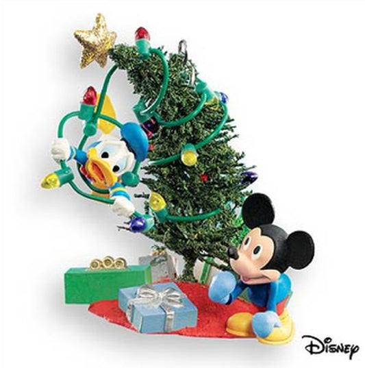Aunt Krismas 'Trimming the Tree' ornament by Lane Feuer. Year: 2007 - Mickey Mouse & Friends  series #0. 'Mint In Box' condition.