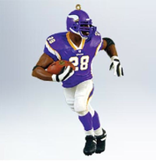 Aunt Krismas 'Adrian Peterson' ornament by Hallmark. Year: 2011 - Football Legends series #17. 'Slightly Damaged Box' condition.